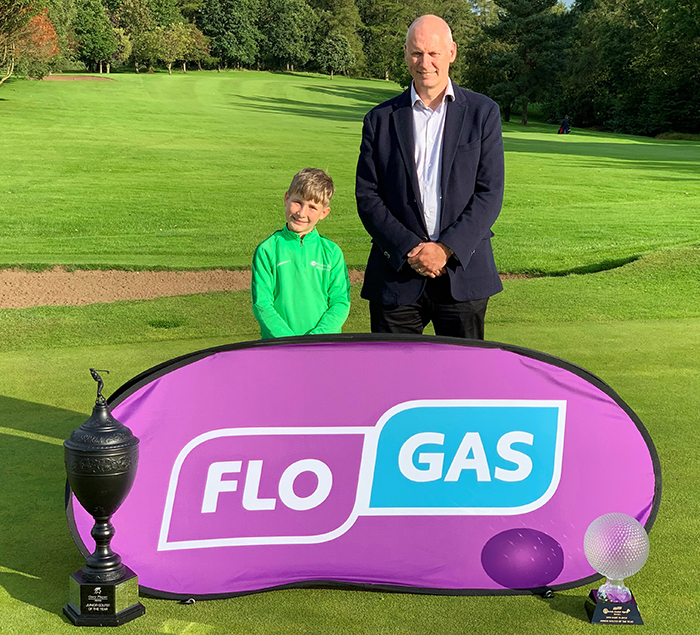 Ruairi Cooper from Enniscorthy Golf Club and John Rooney, Flogas managing director with the prestigious Gary Player trophy